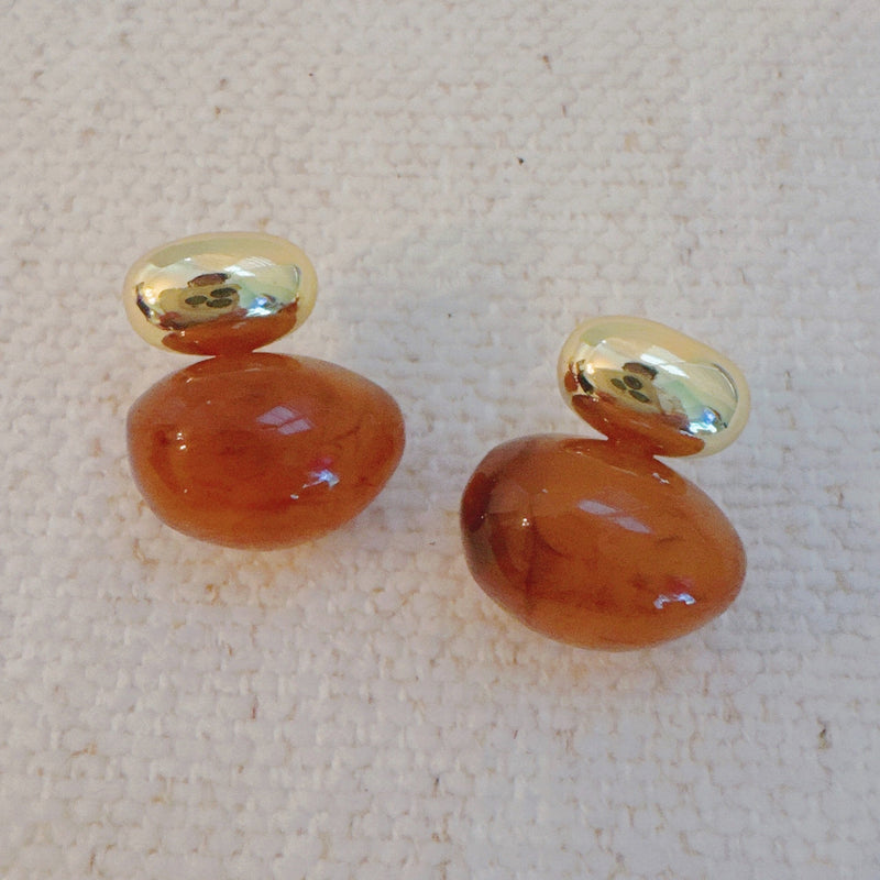 Gold-tone stud earrings featuring a rich espresso-colored drop accent with a sleek and modern silhouette.