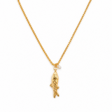Gold necklace with a fish pendant on a white background