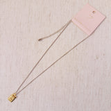 Elegant two-tone necklace featuring a sleek rectangular gold bar pendant on a silver-metal chain, blending modern edge with classic shine