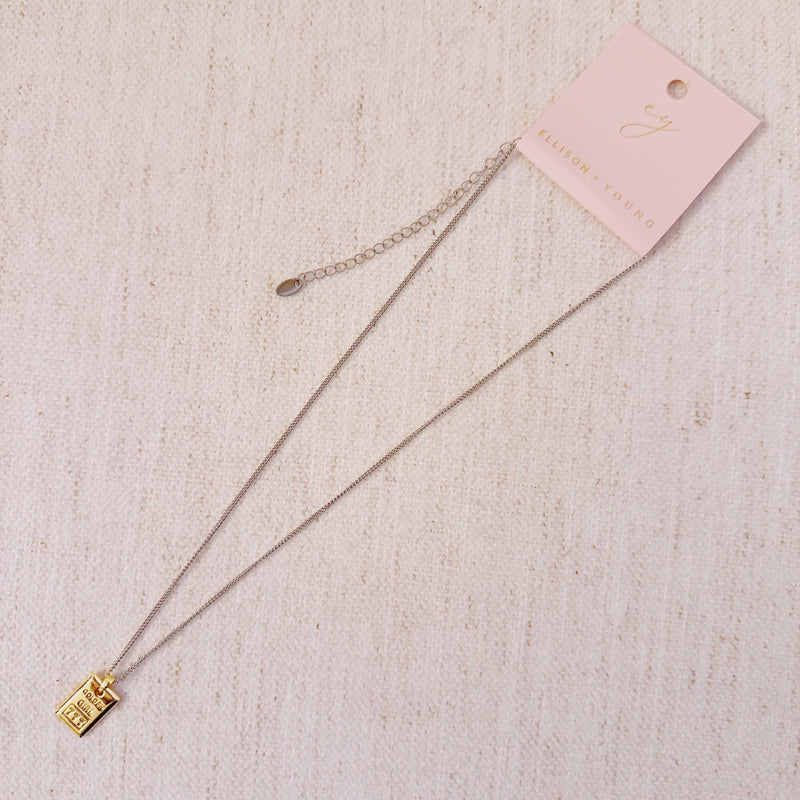 Elegant two-tone necklace featuring a sleek rectangular gold bar pendant on a silver-metal chain, blending modern edge with classic shine