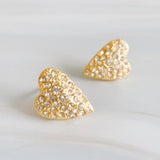 Gold heart-shaped stud earring adorned with sparkling crystals. The design offers a timeless, lovely touch with a delicate shine perfect for everyday wear or special occasions.