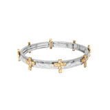 Two-tone bracelet with gold and silver accents on a white background