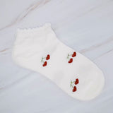 Playful set of three socks featuring cherry and heart motifs in fun, perfect for adding a cute and fruity flair to your everyday style.