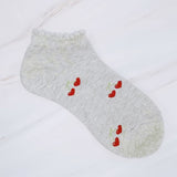 Playful set of three socks featuring cherry and heart motifs in fun, perfect for adding a cute and fruity flair to your everyday style.