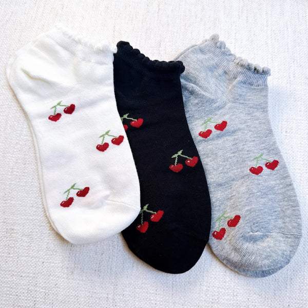 Playful set of three socks featuring cherry and heart motifs in fun, perfect for adding a cute and fruity flair to your everyday style.
