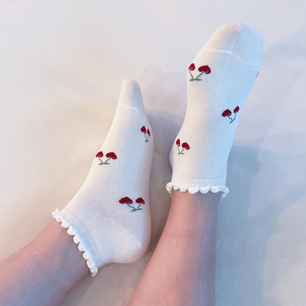 Playful set of three socks featuring cherry and heart motifs in fun, perfect for adding a cute and fruity flair to your everyday style.