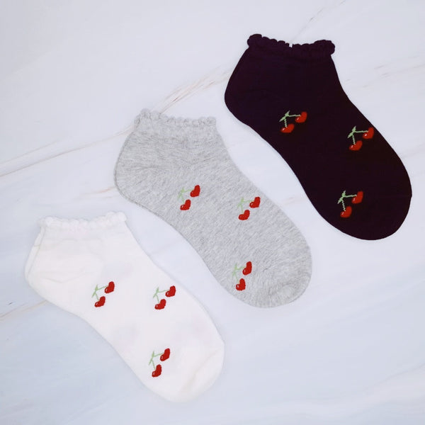 Playful set of three socks featuring cherry and heart motifs in fun, perfect for adding a cute and fruity flair to your everyday style.