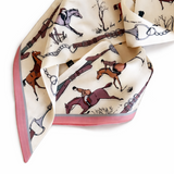 Silk scarf with equestrian-themed design on a white background