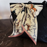 Decorative scarf with horse and equestrian pattern on a black background