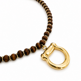 Necklace with brown beads and a gold clasp on a white background
