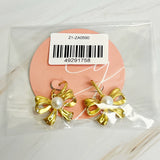 Boucles d'oreilles parfaites avec nœud et perles