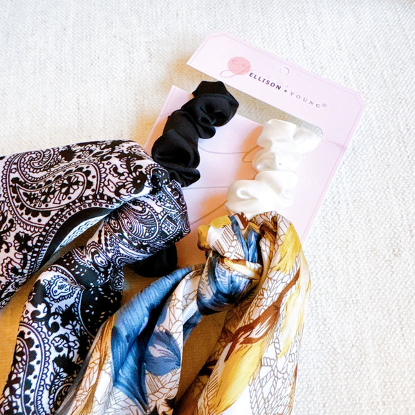  Set of two scrunchies featuring classic bandana scarf designs in nautical-inspired prints—combining style and function for a coastal, carefree look.