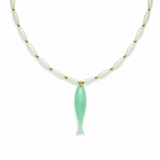 A delicate necklace featuring light green jade-like beads separated by small gold spacer beads, with a larger light green jade pendant shaped like a fish with carved details, set against a plain white background.