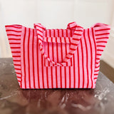 Oversized beach bag made from plush terry cloth material, designed with sturdy handles and a spacious interior—perfect for carrying towels, swimwear, and summer essentials in cozy, absorbent style.