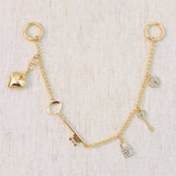 Gold bag charm with key, lock, and ring details – elegant purse accessory