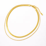 Gold necklaces on a white background