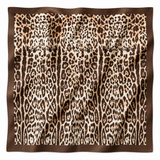 Leopard print fabric with brown border on a white background