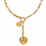 Gold-toned statement necklace featuring a bold chain and a cascading duo of engraved heart-shaped medallion pendants.