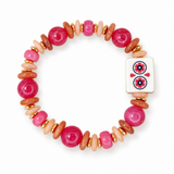 A beaded stretch bracelet featuring large glossy pink beads, smaller matte pink and peach beads, metallic gold spacer rings, and a white square charm with a red and blue floral design, shown on a plain white background.