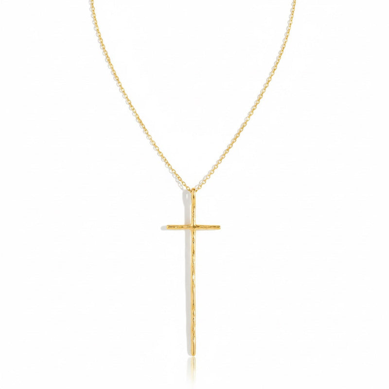 Delicate gold-tone necklace featuring a sleek vertical cross pendant on a fine chain, offering a modern and understated take on a classic faith-inspired design.