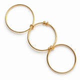 Set of gold hoop earrings on a white background