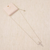 Silver cross pendant necklace featuring a mix of sparkling stone cuts in a modern design, suspended from a delicate chain.