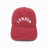 Red cap with 'LONDON' text on a white background