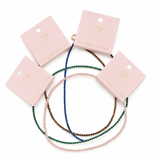 Single strand necklace featuring natural stone beads in warm, earthy tones with subtle color variations and organic shapes, offering a bohemian and grounded look perfect for everyday wear or layering.