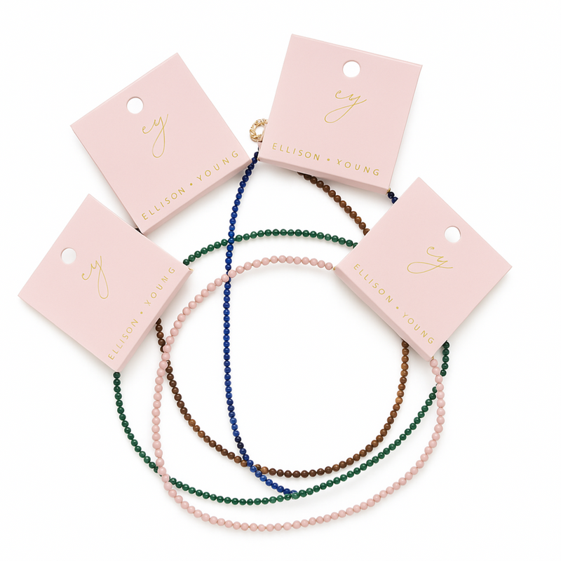 Single strand necklace featuring natural stone beads in warm, earthy tones with subtle color variations and organic shapes, offering a bohemian and grounded look perfect for everyday wear or layering.