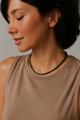 Single strand necklace featuring natural stone beads in warm, earthy tones with subtle color variations and organic shapes, offering a bohemian and grounded look perfect for everyday wear or layering.