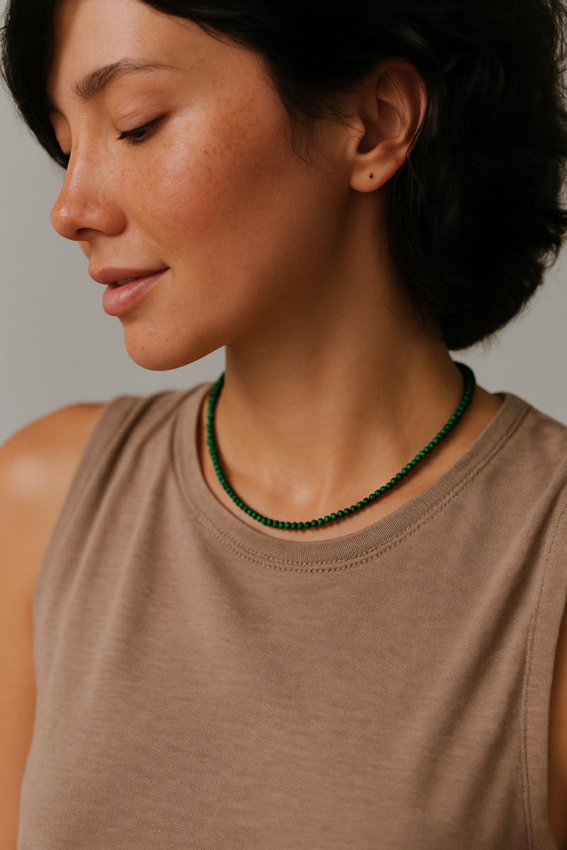 Single strand necklace featuring natural stone beads in warm, earthy tones with subtle color variations and organic shapes, offering a bohemian and grounded look perfect for everyday wear or layering.