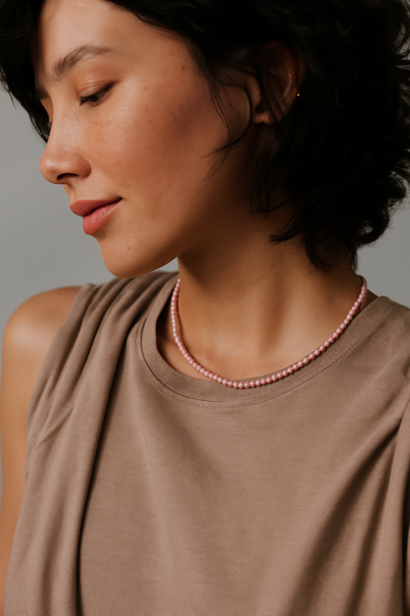 Single strand necklace featuring natural stone beads in warm, earthy tones with subtle color variations and organic shapes, offering a bohemian and grounded look perfect for everyday wear or layering.