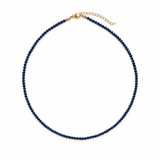 Single strand necklace featuring natural stone beads in warm, earthy tones with subtle color variations and organic shapes, offering a bohemian and grounded look perfect for everyday wear or layering.