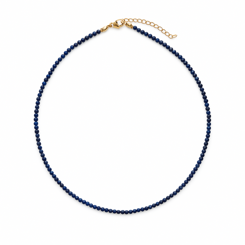 Single strand necklace featuring natural stone beads in warm, earthy tones with subtle color variations and organic shapes, offering a bohemian and grounded look perfect for everyday wear or layering.