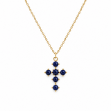 Lapis blue color stone bead cross pendant on gold chain. white background
