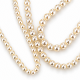Close-up of the lustrous cream acrylic pearl strands from the Noble Pearl 3-Piece Necklace Set showing pearl sheen