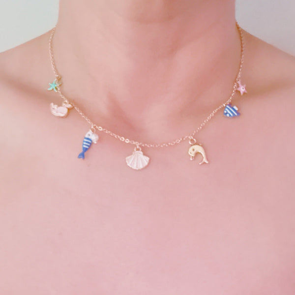 Gold brass necklace with colorful fish, shell, and sea animal charms