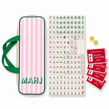 Ellison+Young Palm Resort Mahjong Tile Set with tropical-print crystal tiles and a pink striped storage bag with green MAHJ lettering.