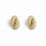 Pair of elegant interlocking loop earrings encrusted with shimmering pavé crystals. The design features two linked ovals forming a sculptural, modern silhouette with a refined, high-shine finish that catches the light beautifully.