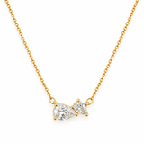 Front close-up of the Pear Cut Crystals Pendant – large and petite pear-cut cubic zirconia in 18k gold plated prong settings on a cable chain