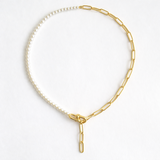 Modern necklace combining half white pearls and half elongated gold chain links. The design blends classic sophistication with a contemporary edge for a balanced, elegant look.