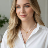 Modern necklace combining half white pearls and half elongated gold chain links. The design blends classic sophistication with a contemporary edge for a balanced, elegant look.