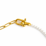 Modern necklace combining half white pearls and half elongated gold chain links. The design blends classic sophistication with a contemporary edge for a balanced, elegant look.