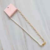 Modern necklace combining half white pearls and half elongated gold chain links. The design blends classic sophistication with a contemporary edge for a balanced, elegant look.