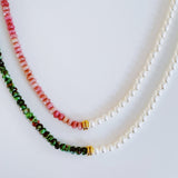 Unique necklace featuring alternating freshwater pearls and gemstone accents, creating a harmonious blend of classic charm and radiant sophistication.