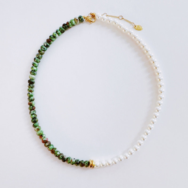 Unique necklace featuring alternating freshwater pearls and gemstone accents, creating a harmonious blend of classic charm and radiant sophistication.
