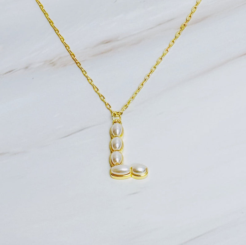 Gold chain necklace featuring an elegant initial pendant inlaid with pearl mosaic accents for a personalized, sophisticated touch.