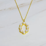 Gold chain necklace featuring an elegant initial pendant inlaid with pearl mosaic accents for a personalized, sophisticated touch.