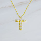 Gold chain necklace featuring an elegant initial pendant inlaid with pearl mosaic accents for a personalized, sophisticated touch.