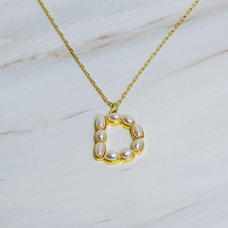 Gold chain necklace featuring an elegant initial pendant inlaid with pearl mosaic accents for a personalized, sophisticated touch.